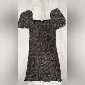 Black floral short dress. Very stretchy. Size medium.